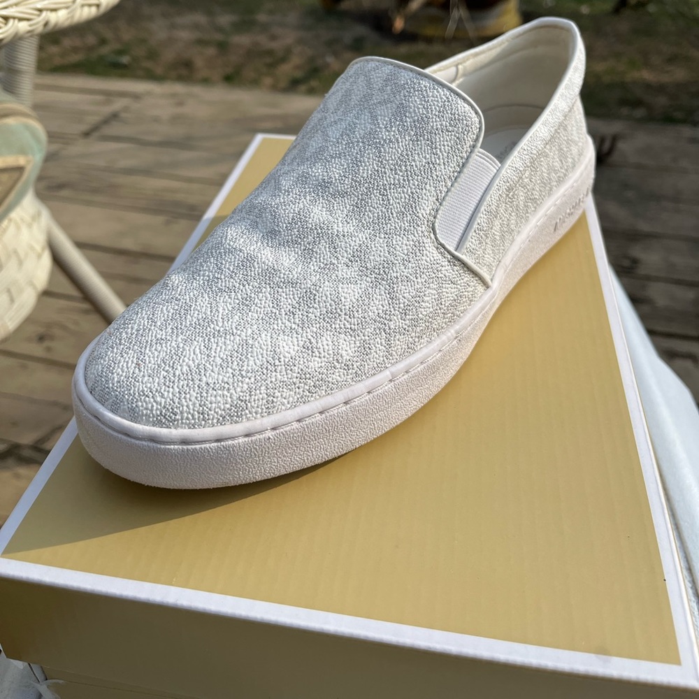 Brand New White canvas printed logo slip on shoes only worn 3 times